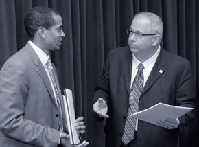 Frank Pugh extends an invitation for First Lady Michelle Obama to William Jawando of the Office of Public Engagement.